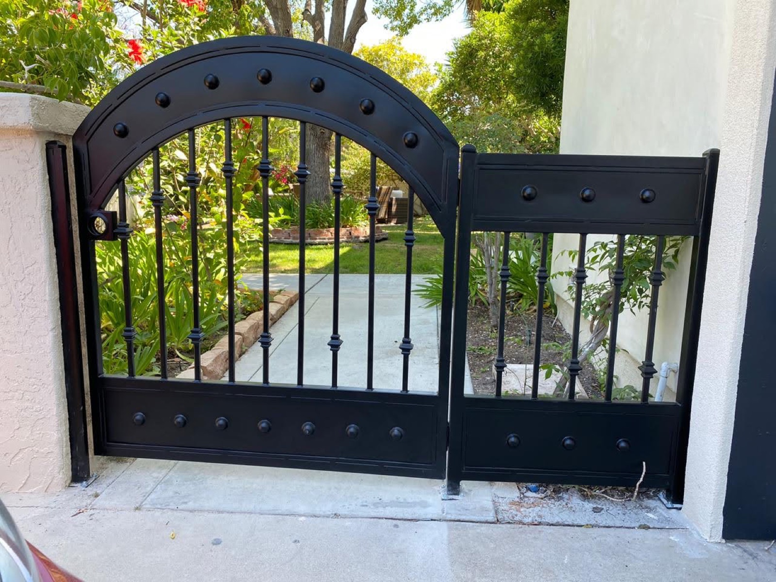 Black arched pedestrian gate