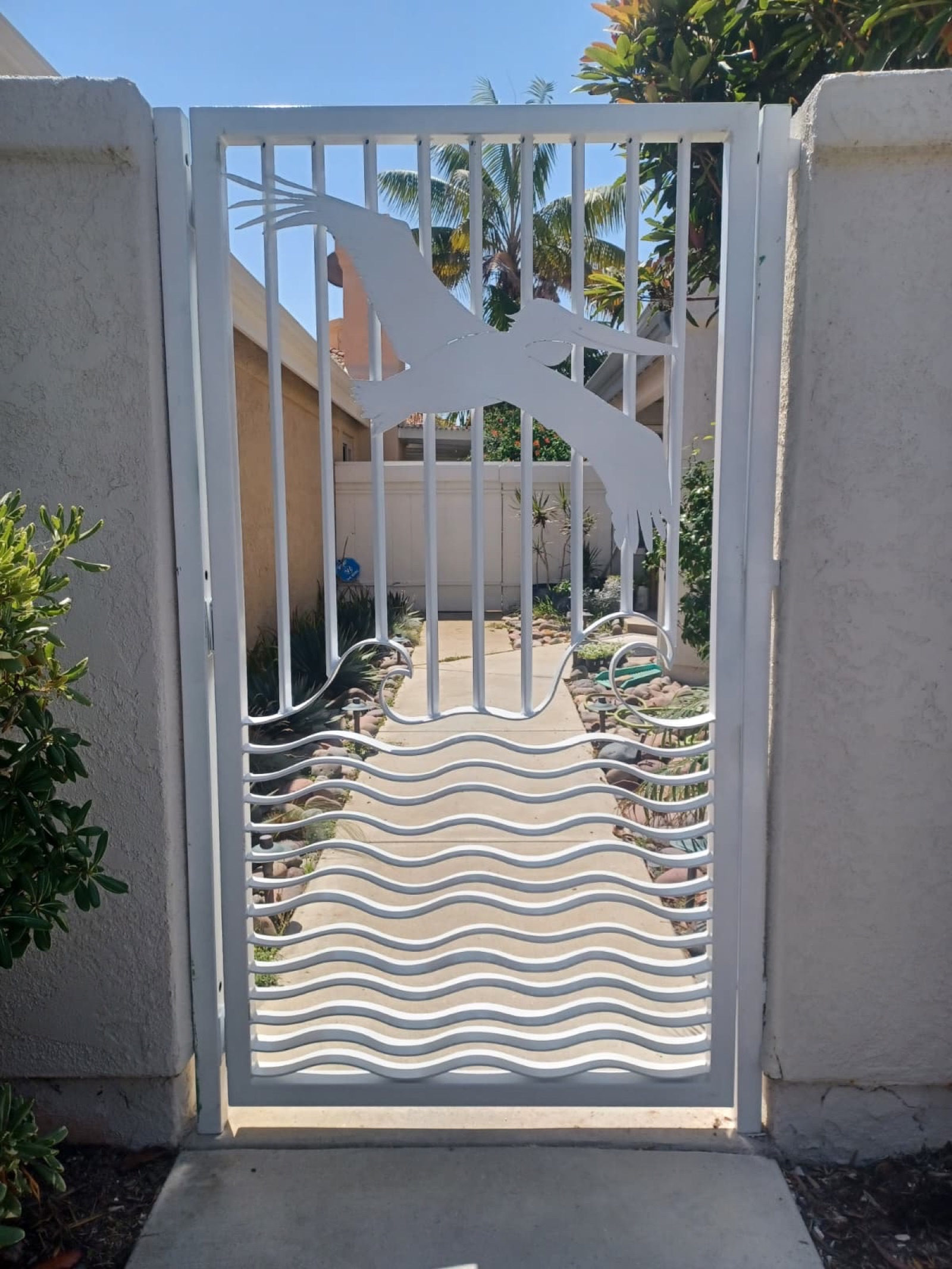White custom metal gate with bird design