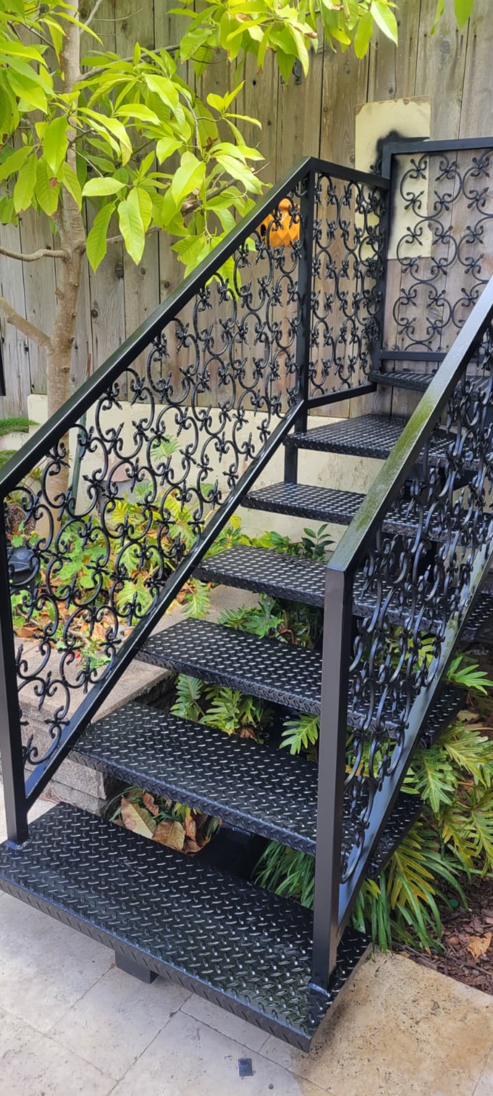 Black ornamental metal stair and railings